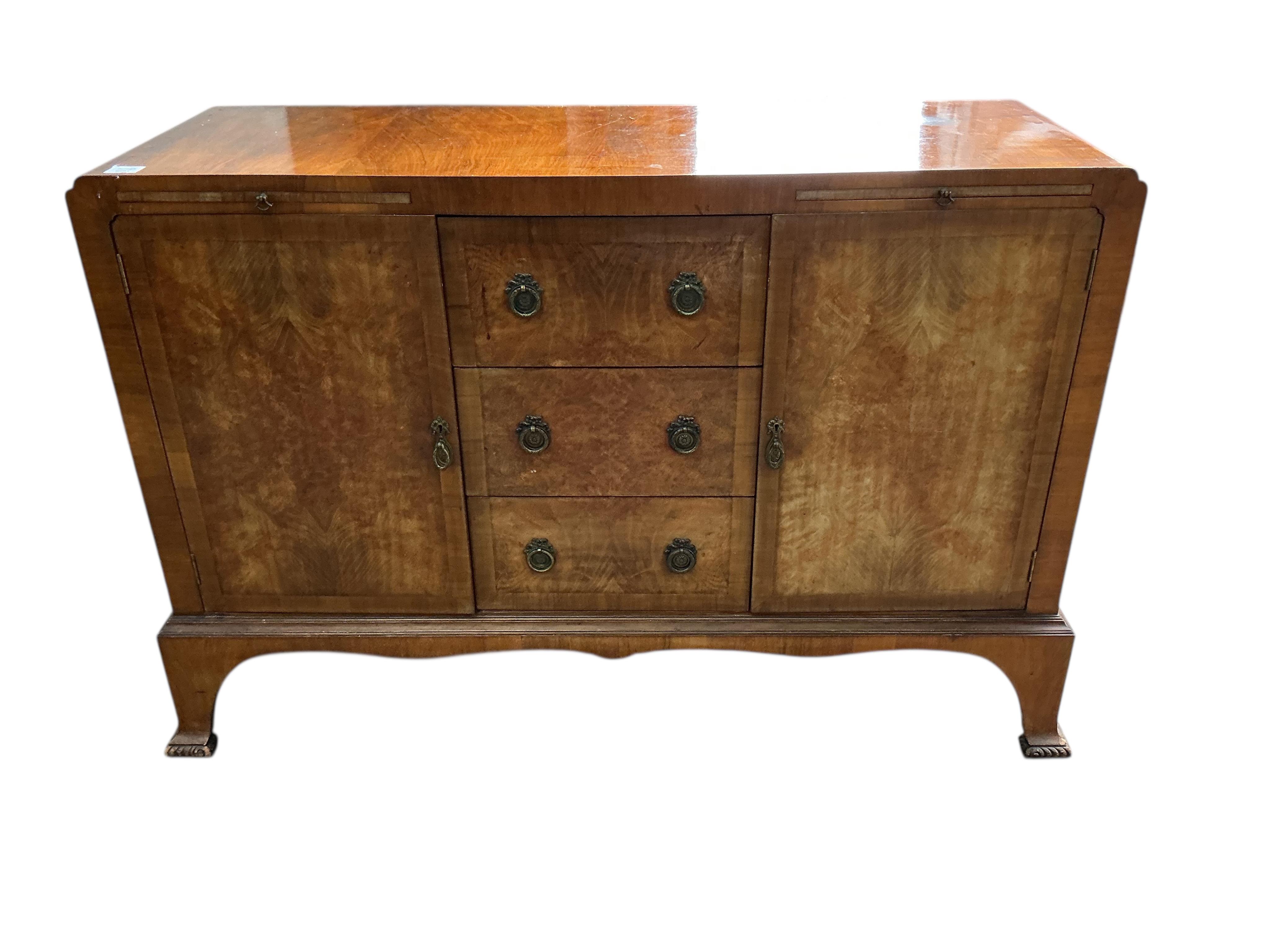 A 1930’s walnut sideboard, width 132cm, depth 46cm, height 90cm